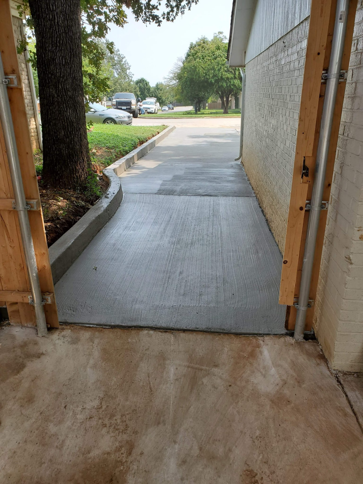 New concrete walkway along a home