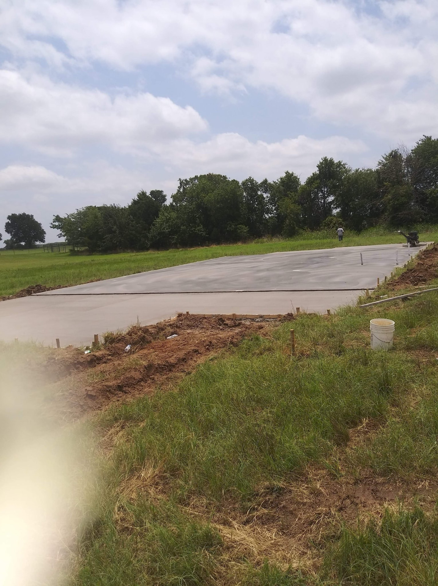 Long concrete slab poured on a rural property