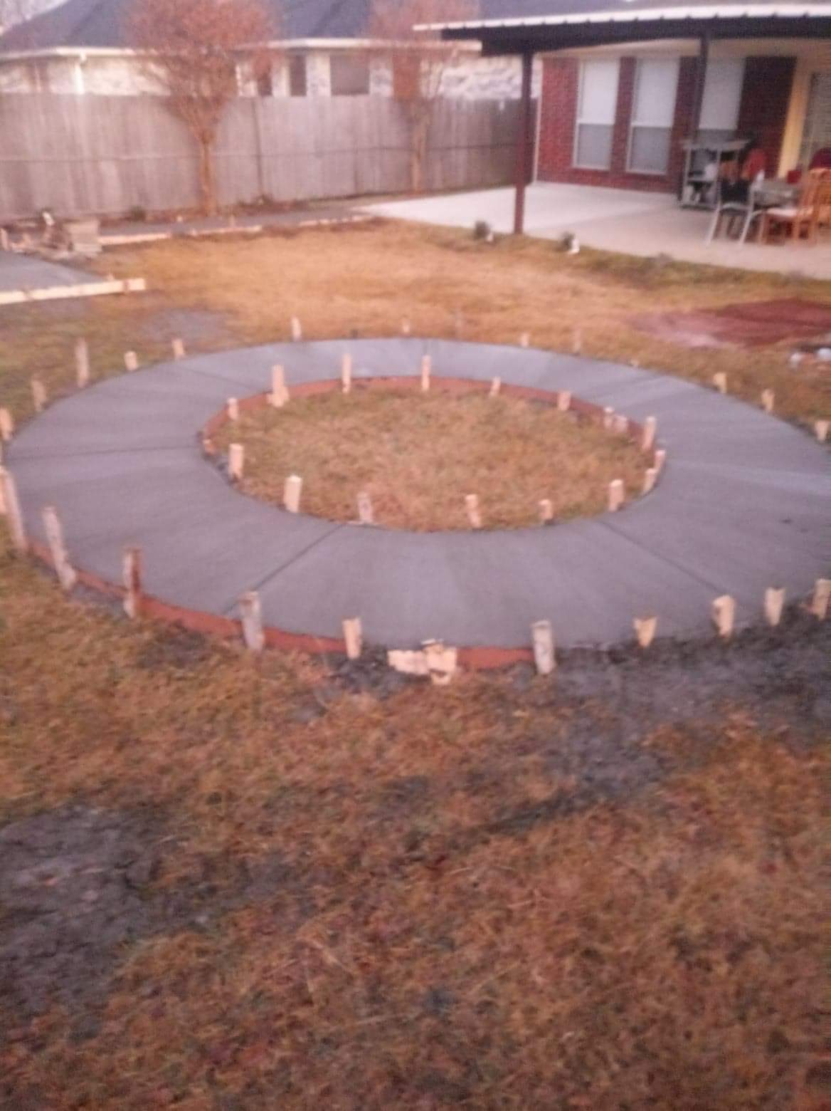 Curved concrete feature formed and finished in a backyard